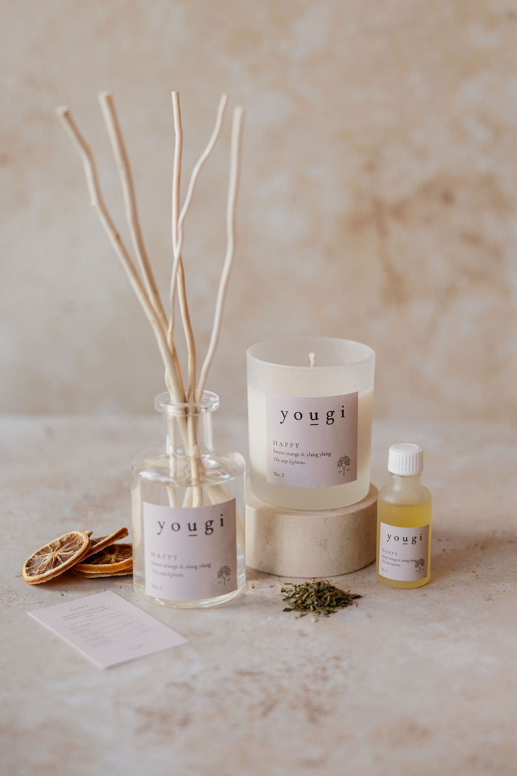 Happy candle, reed diffuser and pure essential oil together on the workshop bench