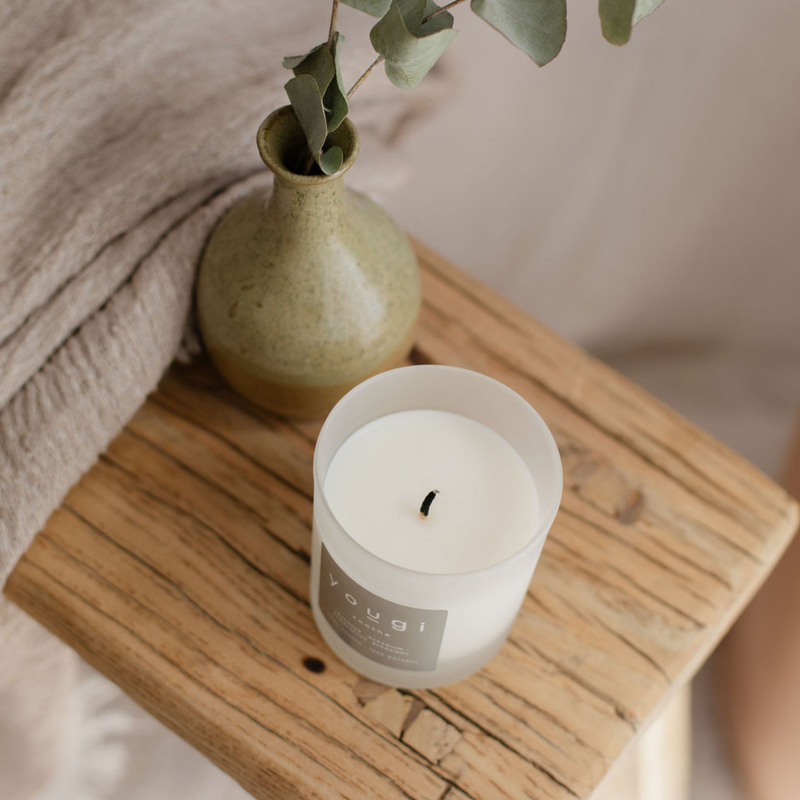 Yougi Soothe candle burnt on side table