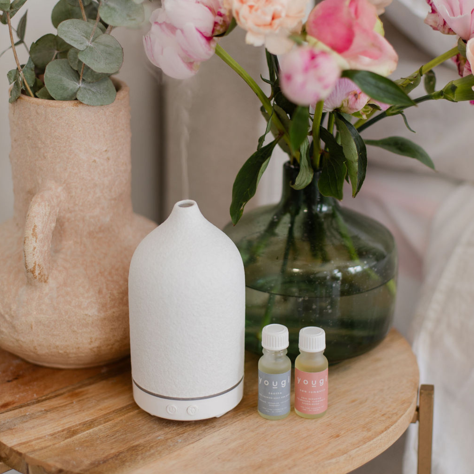 A Yougi electric diffuser scenting a room.