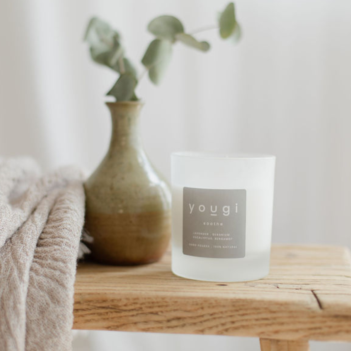 Yougi natural soy candles in amber glass.
