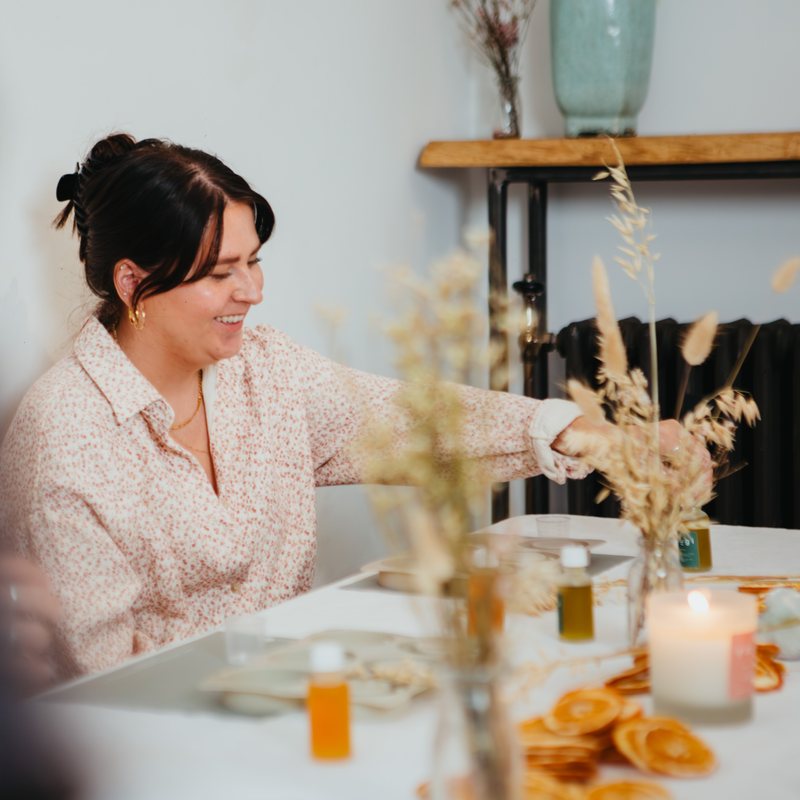 A tidy home-working space with a natural candle.