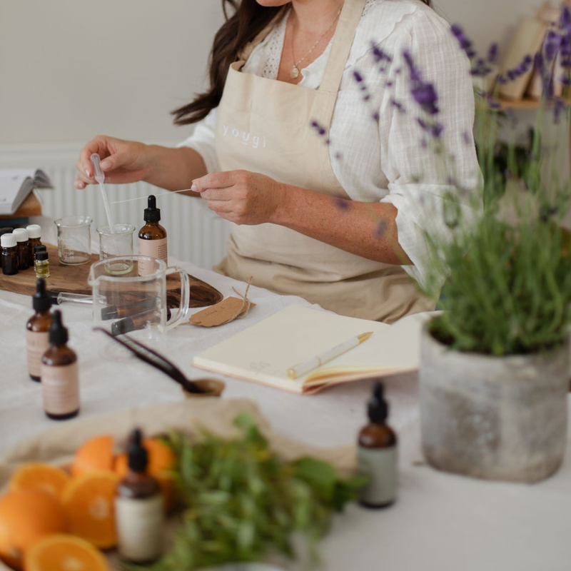 Experimenting with essential oils to make scent.