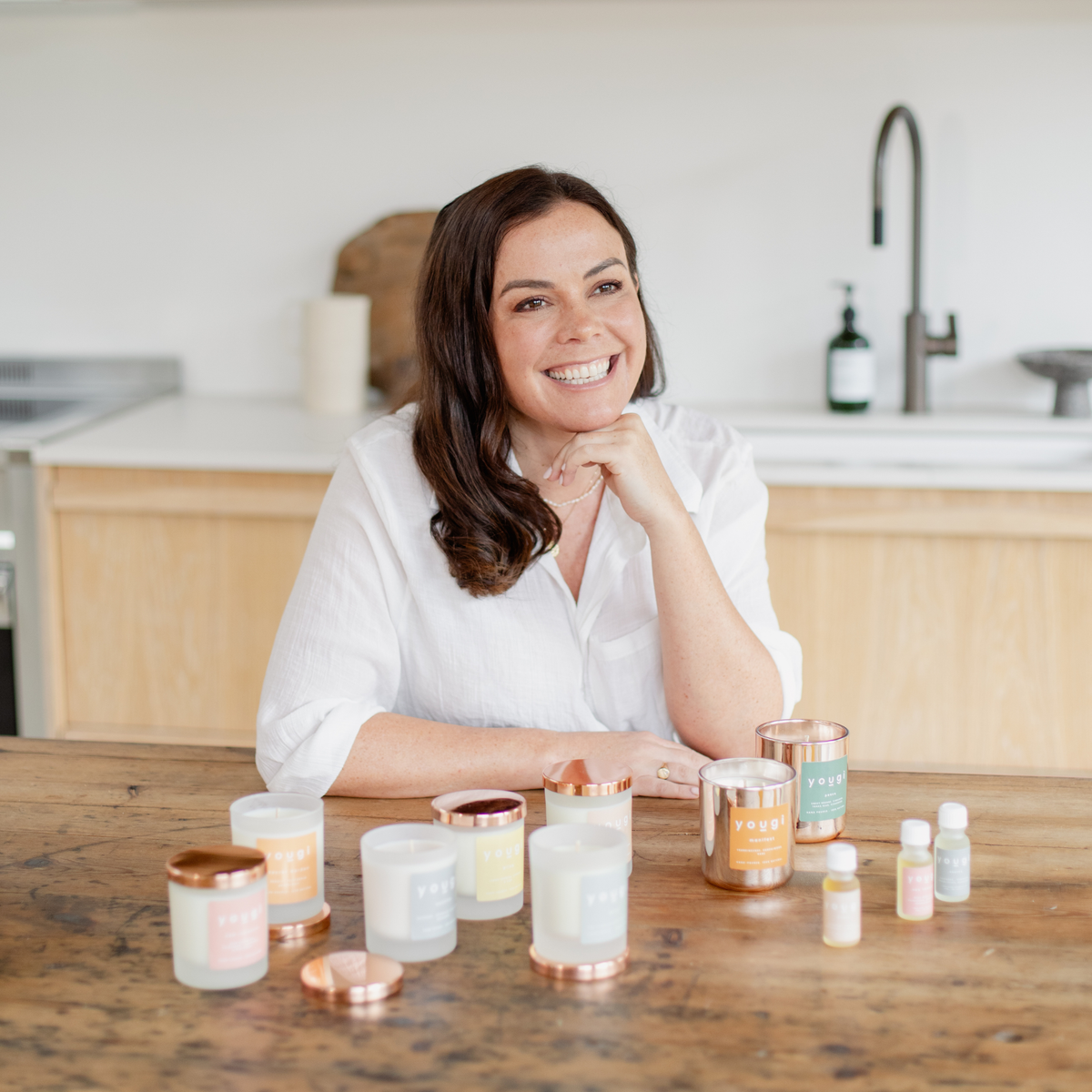 Emily Lynam making candles by hand in the studio.
