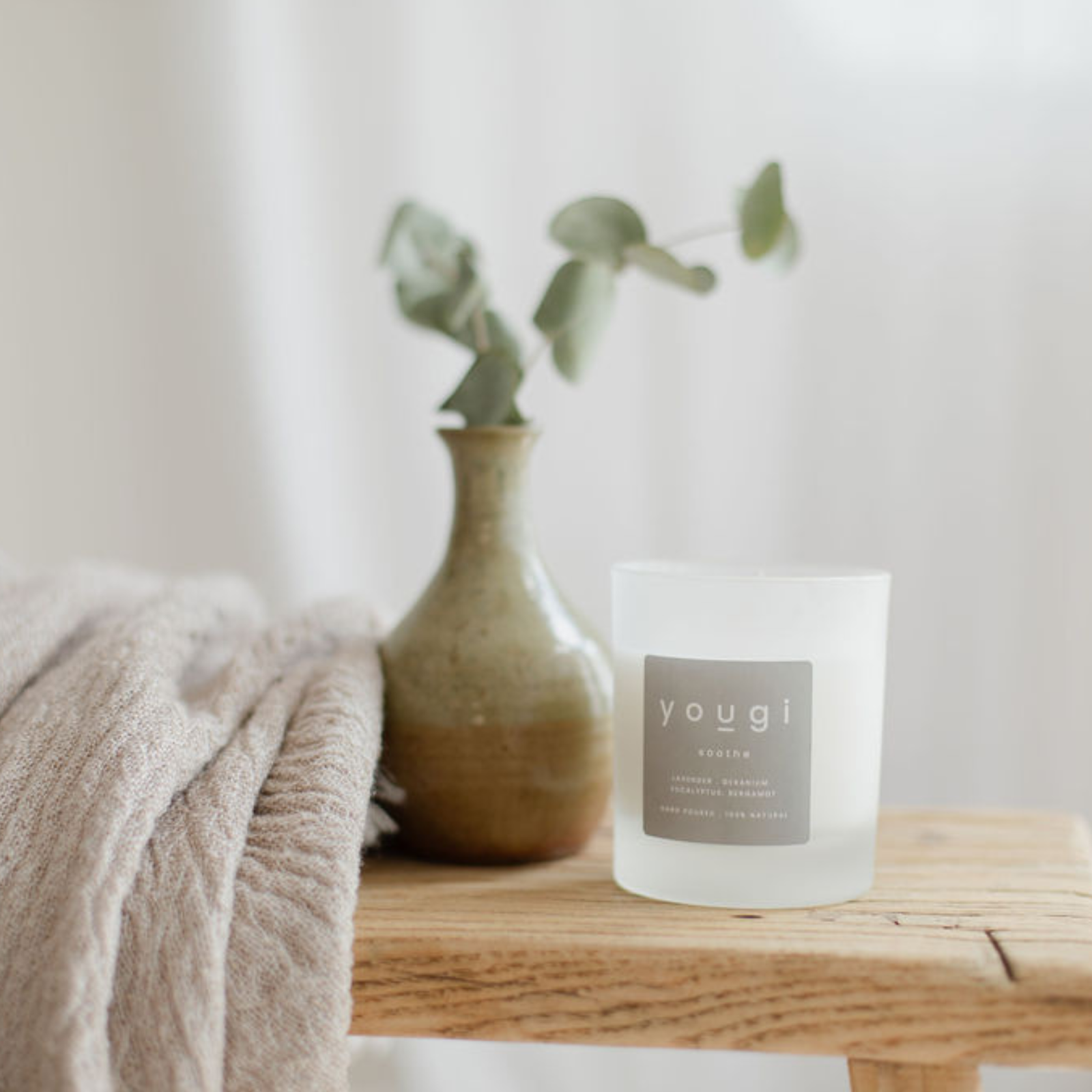 An empty candle glass reused as a small vessel.