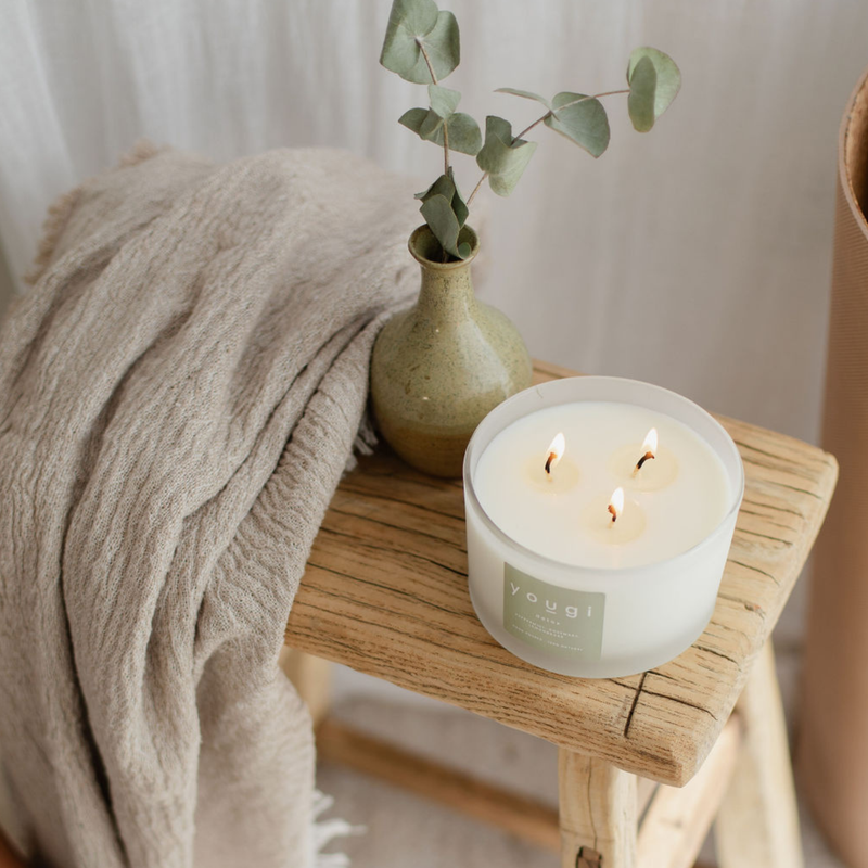 A candle lit for a Lunar New Year clearing ritual.