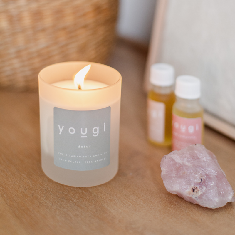 Caring for a soy candle with a trimmed wick.