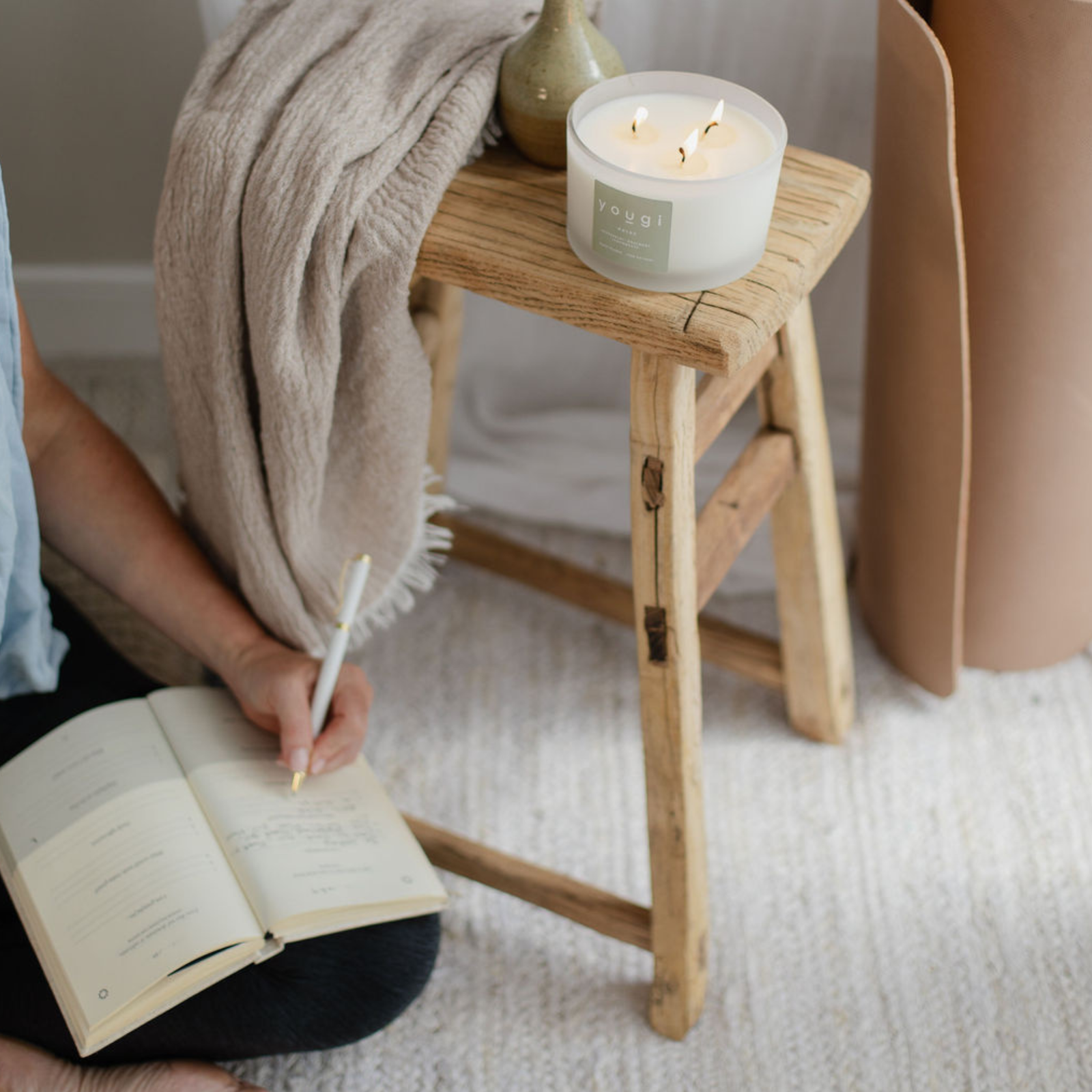 A calm desk with a natural candle for focus.