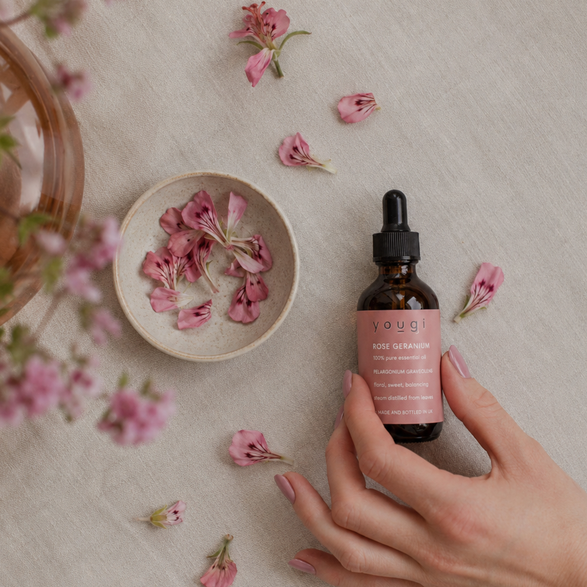 A selection of pure essential oil bottles with botanicals.