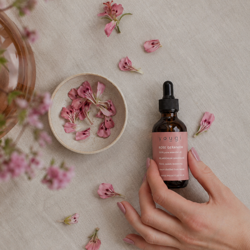 A selection of pure essential oil bottles with botanicals.