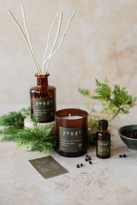 Forest Bathing candle, reed diffuser and pure essential oil together on the workshop bench