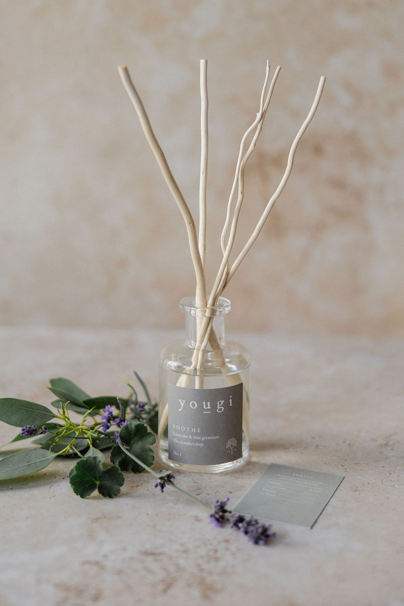 The Soothe reed diffuser in frosted glass with lavender and eucalyptus, the scent card beside it