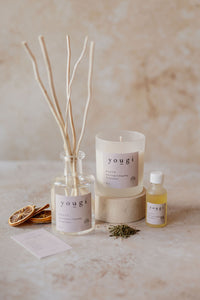 Happy candle, reed diffuser and pure essential oil together on the workshop bench