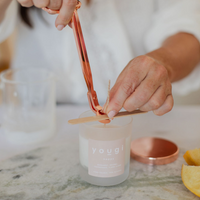 Setting the cotton wick on a hand-poured mini candle
