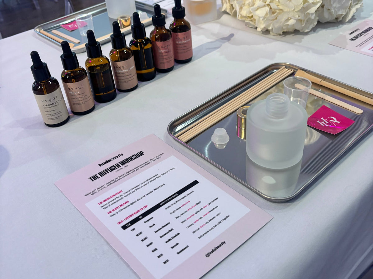 Yougi essential oil blends, a reed diffuser and the Huda Beauty diffuser workshop card, at the Huda Beauty event