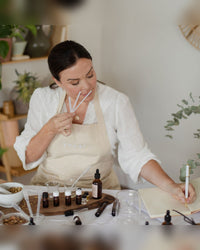 Blending a perfume with testing strips at the studio on Connaught Street